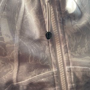 Uniquely patterned Define Jacket by Lululemon. Size 2. Fantastic condition.
